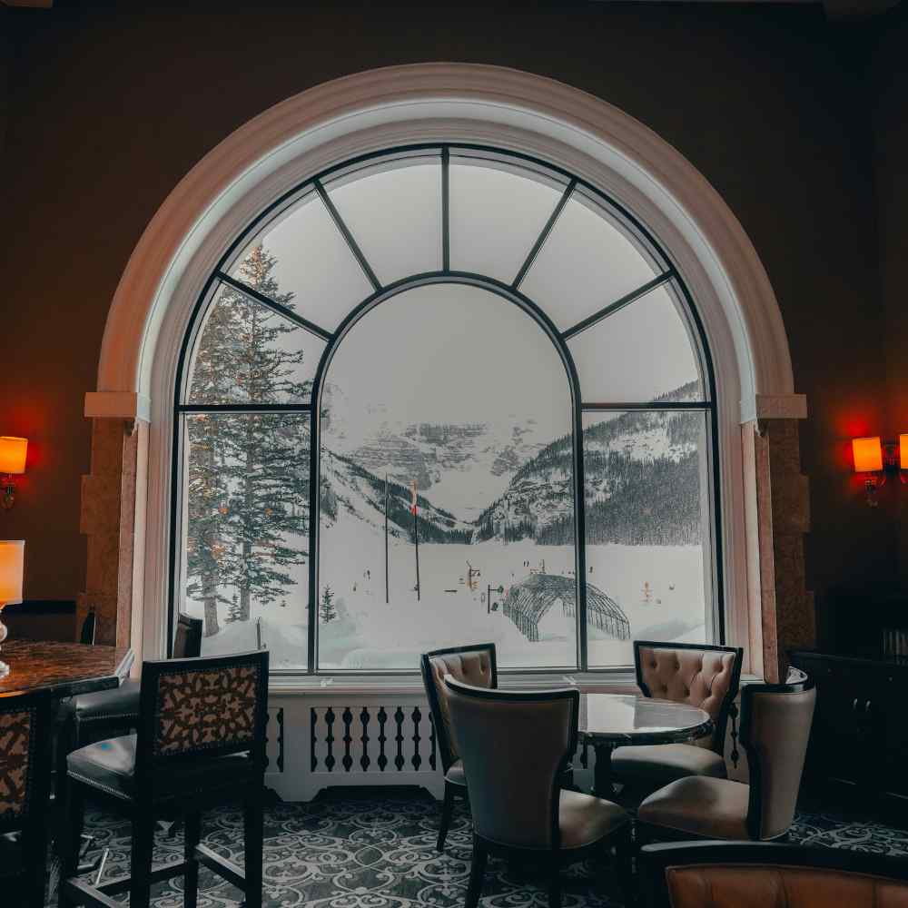 Restaurant with large windon snowy outside in banff alberta