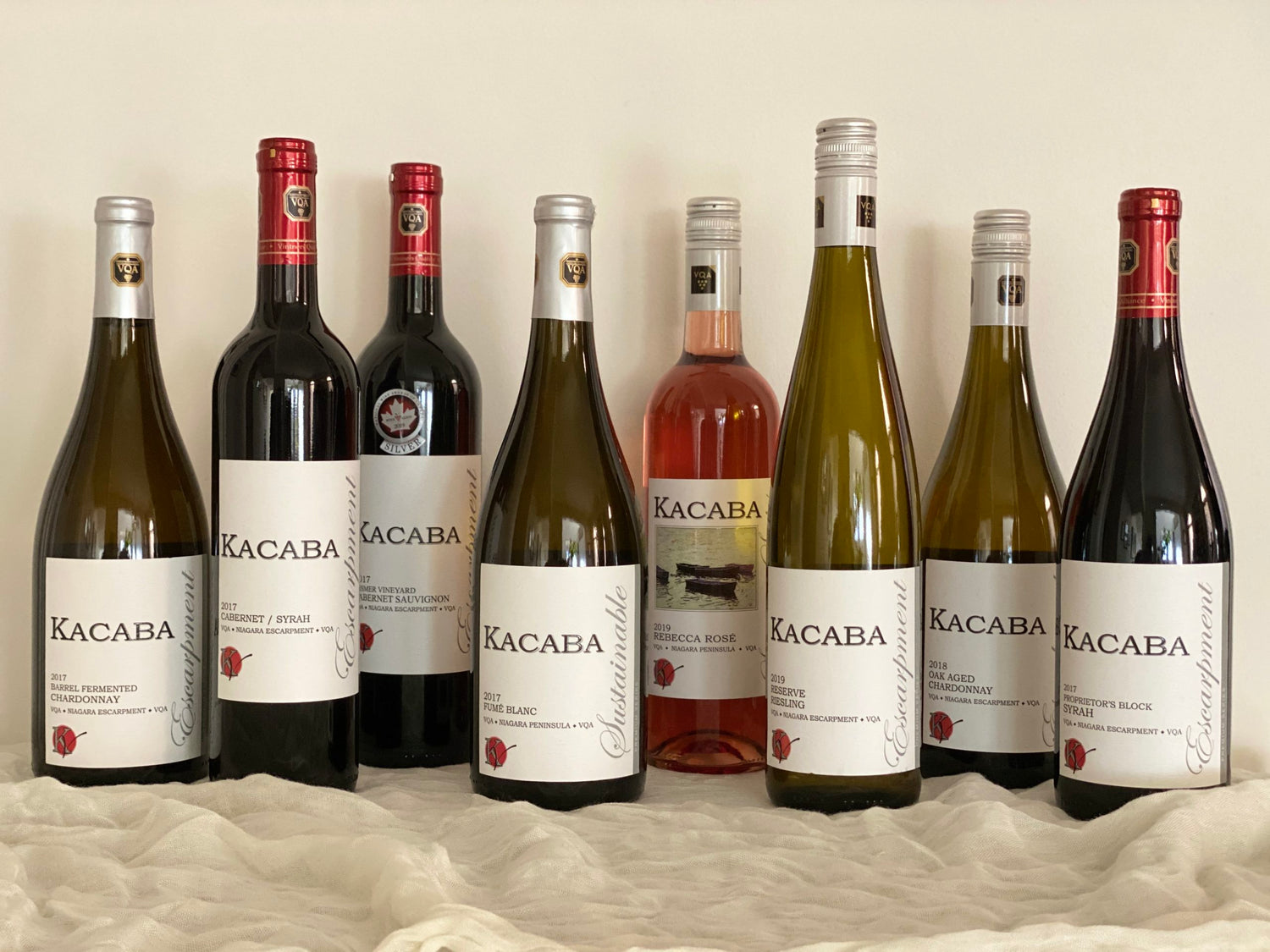 Bottles of Kacaba wine displayed for a promotional photo at wine club