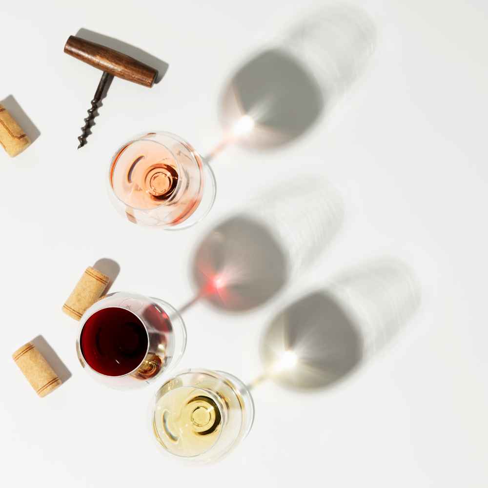 View from the top of different wine glasses red wine and rose, with cork