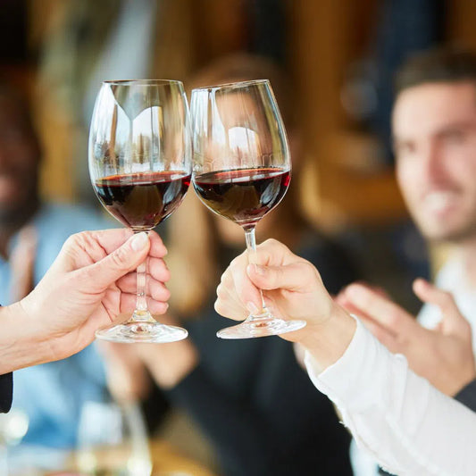 Red wine glasses in corporate gift table