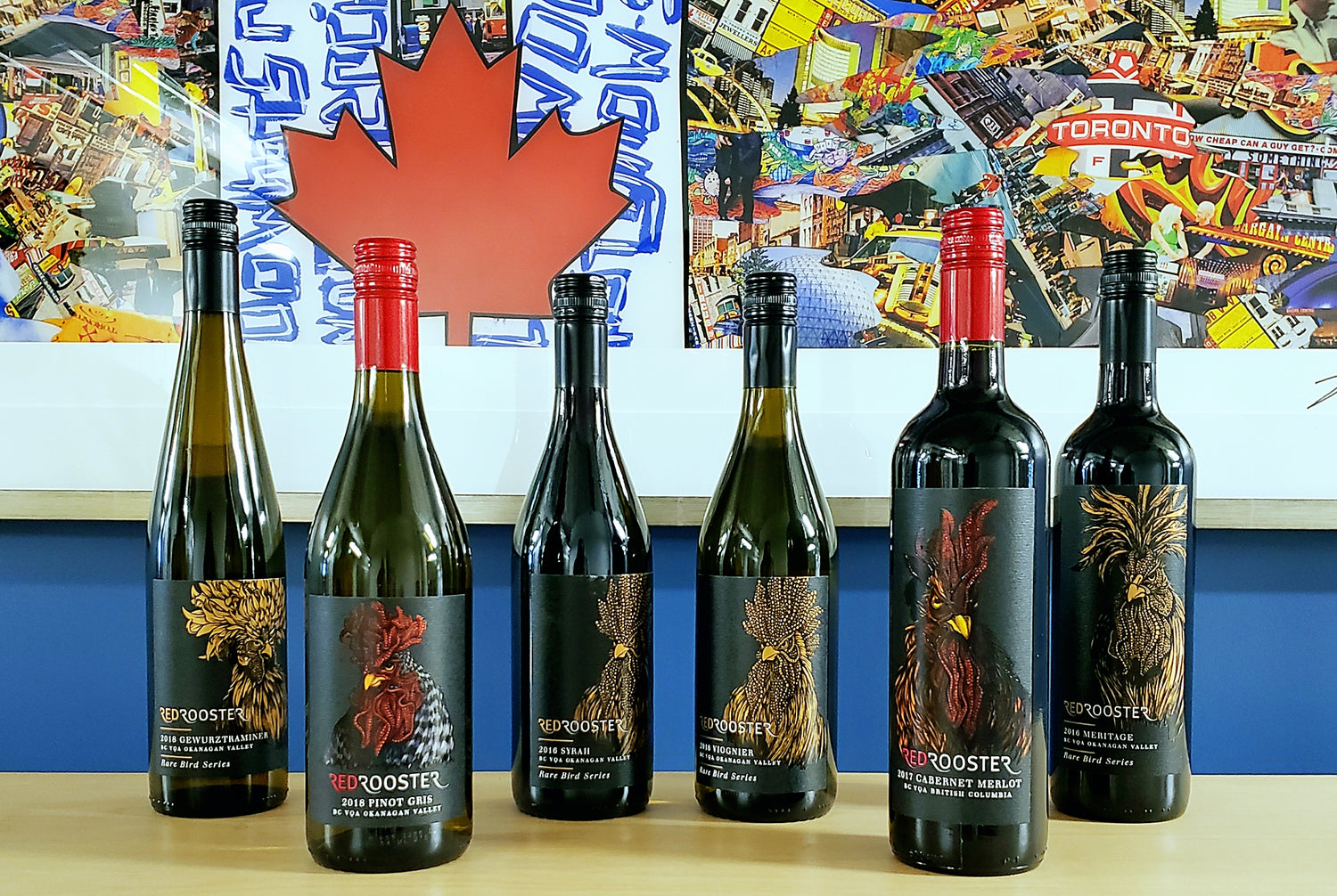 Red Rooster  red wine bottles and pinot on display for a promotional event