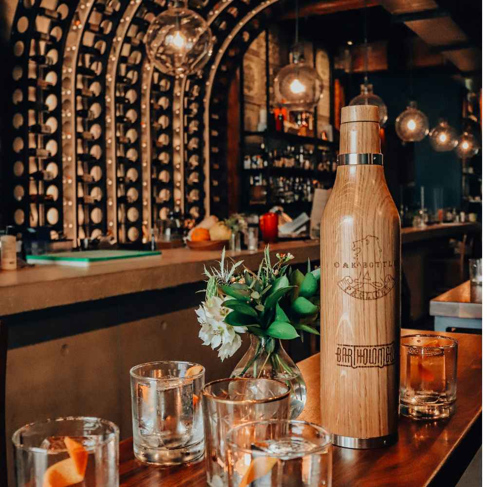 Hip bar in vancouver showing wine and cocktails at a table