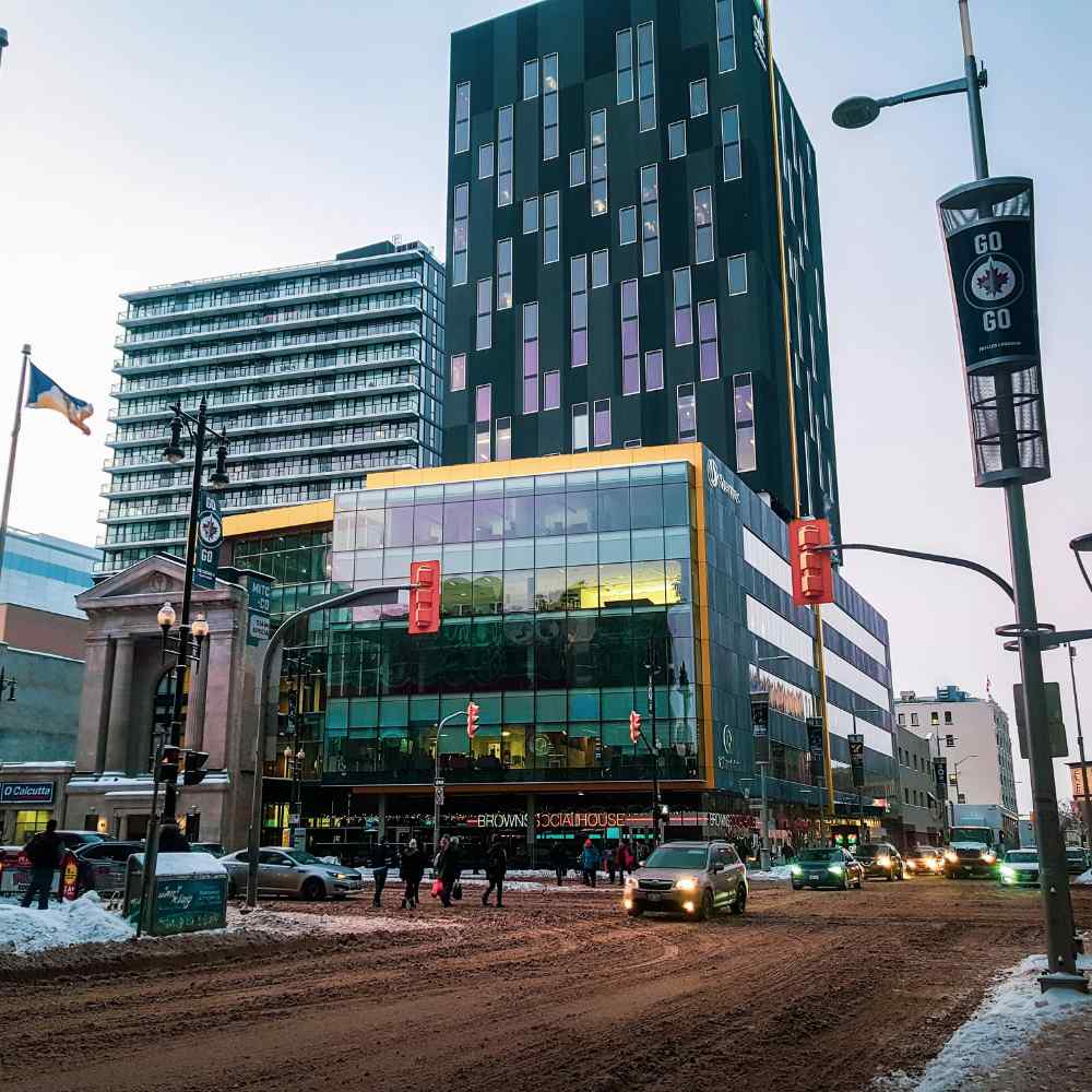 Winnipeg downtown street with hockey jets sign in snowy day